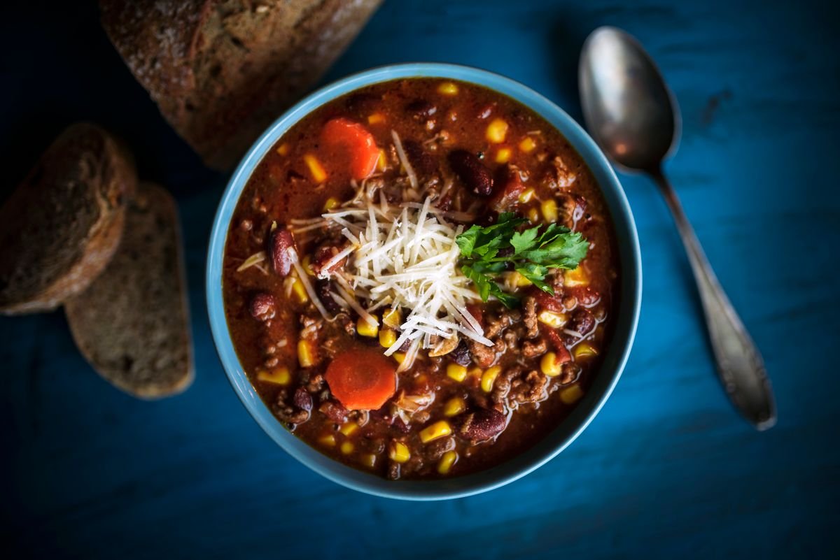 Bowl of hearty keto chili topped with cheese
